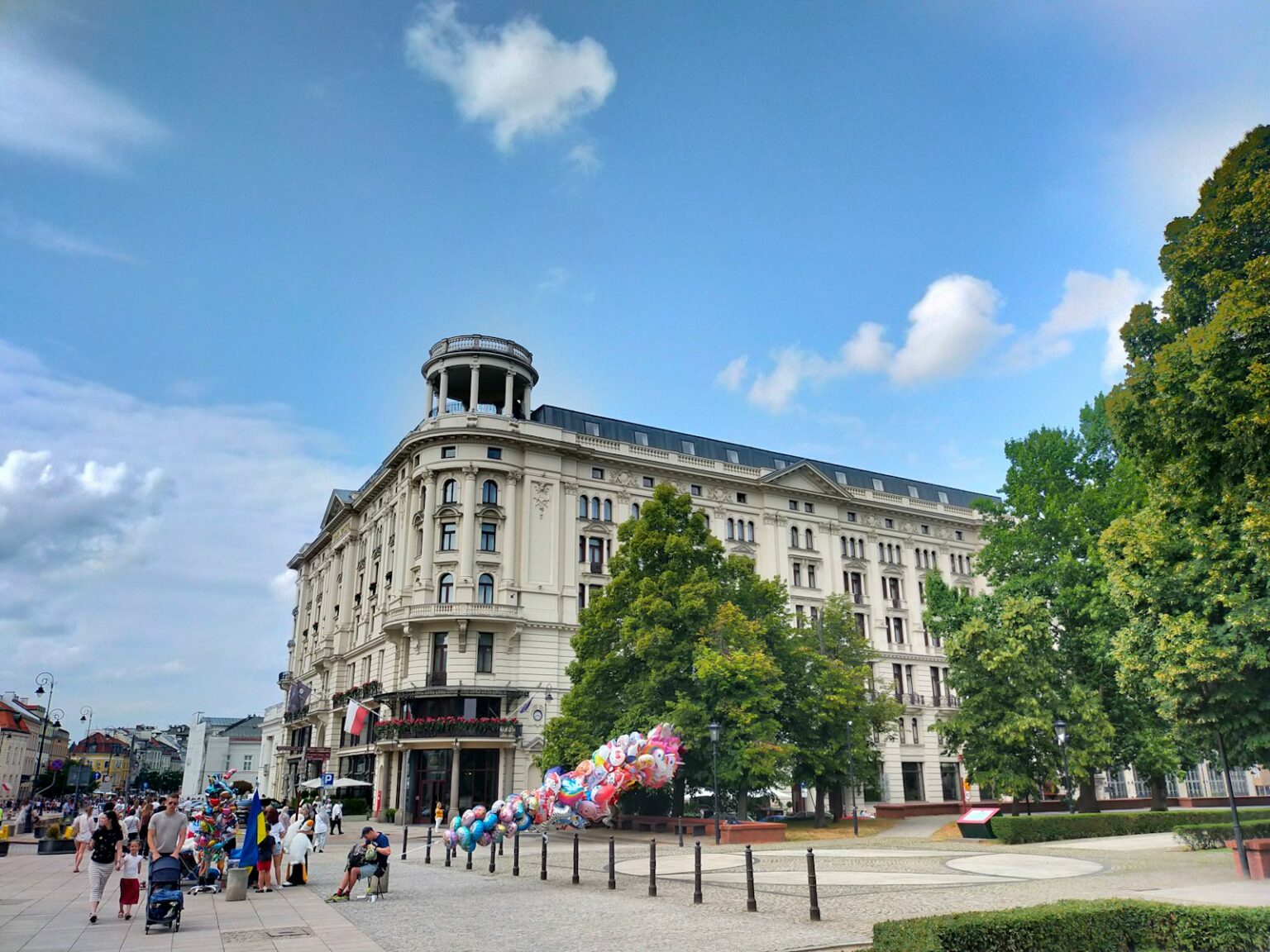 A group of people standing in front of a building